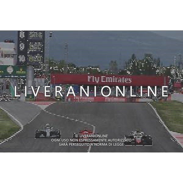 (L to R): Valtteri Bottas (FIN) Mercedes AMG F1 W09 leaves the pits as Sebastian Vettel (GER) Ferrari SF71H overtakes Kevin Magnussen (DEN) Haas VF-18. 13.05.2018. Formula 1 World Championship, Rd 5, Spanish Grand Prix, Barcelona, Spain, Race Day. / AGENZIA ALDO LIVERANI SAS - ITALY ONLY EDITORIAL USE ONLY - F1 GP SPAGNA GARA BARCELLONA 13.05.2018