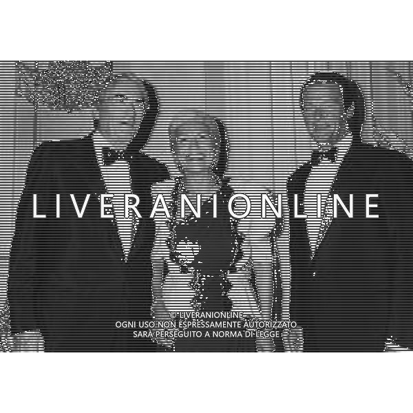 MARIA PIA FANFANI, scrittrice e volontaria della Croce Rossa Italiana - RETROSPETTIVA nella foto con Gregory Peck e Roger Moore ©ARCHIVIO / AGENZIA ALDO LIVERANI SAS
