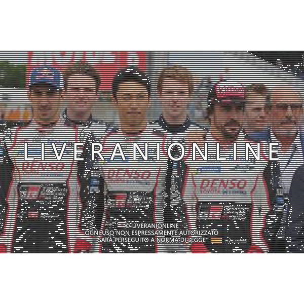(L to R): Sebastien Buemi (SUI) / Kazuki Nakajima (JPN) / Fernando Alonso (ESP) #08 Toyota Gazoo Racing Toyota TS050 Hybrid, on the grid. 16-17.06.2018. FIA World Endurance Championship, Le Mans 24 Hours, Race, Le Mans, France. AG ALDO LIVERANI SAS-ONLY ITALY