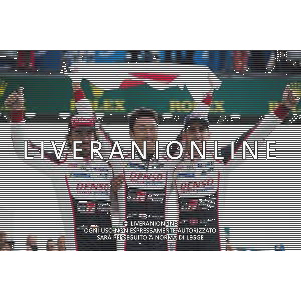 (L to R): Race winners Fernando Alonso (ESP); Kazuki Nakajima (JPN); and Sebastien Buemi (SUI) #08 Toyota Gazoo Racing, celebrate in parc ferme. 16-17.06.2018. FIA World Endurance Championship, Le Mans 24 Hours, Race, Le Mans, France. AG ALDO LIVERANI SAS-ONLY ITALY