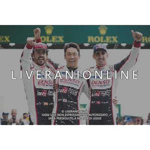 (L to R): Race winners Fernando Alonso (ESP); Kazuki Nakajima (JPN); and Sebastien Buemi (SUI) #08 Toyota Gazoo Racing, celebrate in parc ferme. 16-17.06.2018. FIA World Endurance Championship, Le Mans 24 Hours, Race, Le Mans, France. AG ALDO LIVERANI SAS-ONLY ITALY
