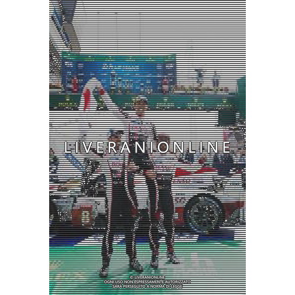 (L to R): Race winners Fernando Alonso (ESP); Kazuki Nakajima (JPN); and Sebastien Buemi (SUI) #08 Toyota Gazoo Racing, celebrate in parc ferme. 16-17.06.2018. FIA World Endurance Championship, Le Mans 24 Hours, Race, Le Mans, France. AG ALDO LIVERANI SAS-ONLY ITALY