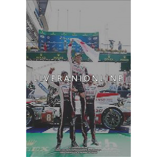 (L to R): Race winners Fernando Alonso (ESP); Kazuki Nakajima (JPN); and Sebastien Buemi (SUI) #08 Toyota Gazoo Racing, celebrate in parc ferme. 16-17.06.2018. FIA World Endurance Championship, Le Mans 24 Hours, Race, Le Mans, France. AG ALDO LIVERANI SAS-ONLY ITALY