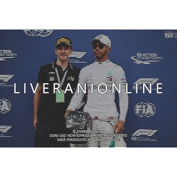 Lewis Hamilton (GBR) Mercedes AMG F1 receives his Pirelli Pole Position Award from Simon Yates (GBR) Cyclist. 23.06.2018. Formula 1 World Championship, Rd 8, French Grand Prix, Paul Ricard, France, Qualifying Day. / AGENZIA ALDO LIVERANI SAS - ITALY ONLY EDITORIAL USE ONLY - F1 GP FRANCIA PROVE UFFICIALI QUALIFICHE 23.06.2018
