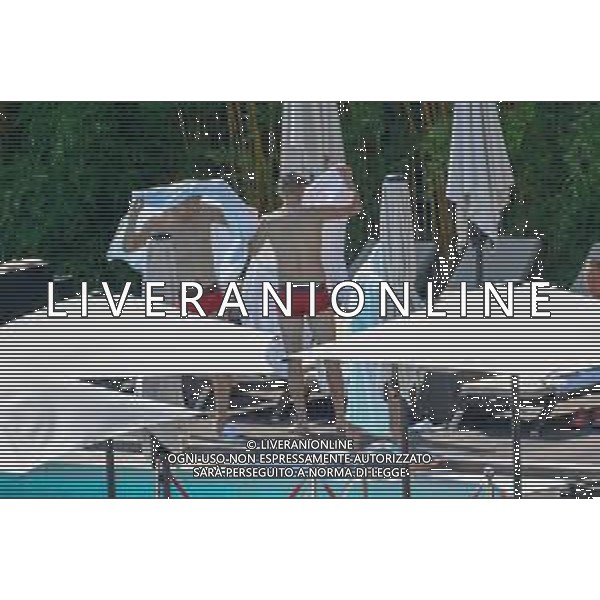 !!! EXCLUSIVE PHOTOS!!! !!! UWAGA ZDJECIA PAPARAZZI !!! BRAK ZGODY NA PUBLIKACJE WIZERUNKU !!! KADROWICZE PO PRZEGRANYM DRUGIM MECZU NA MUNDIALU RELAKSUJA SIE NA BASENIE. ZADOWOLENI USMIECHNIECI ZRELAKSOWANI WYCHODZA NA TRENING. WIEKSZOSC ZAWODNIKOW WYCHODZI Z TELEFONAMI NA TRENING. PRAWIE WSZYSCY SMIEJA SIE I SZUKAJA MIEJSCA SKAD SA ROBIONE IM ZDJECIA. JEDYNA PRZEJETA OSOBA JEST MICHAL PAZDAN KTORY CALY CZAS TRENINGU RZETELNIE PRACOWAL W SKUPIENIU I ZOSTAL JAKO OSTATNI Z DRUZYNY. N/Z JACEK GORLASKI I LUKASZ TEODORCZYK MUNDIAL 2018 25.06.2018 SOCHI TOBIASZ/NEWSPIX --- Newspix.pl Polish national team training in Sochi, part of the players training on the pitch, those who played with Colombia are training in the hotel, by the pool POLAND OUT!!! AG ALDO LIVERANI SAS-ONLY ITALY