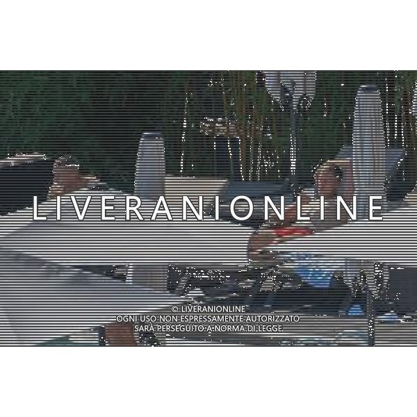 !!! EXCLUSIVE PHOTOS!!! !!! UWAGA ZDJECIA PAPARAZZI !!! BRAK ZGODY NA PUBLIKACJE WIZERUNKU !!! KADROWICZE PO PRZEGRANYM DRUGIM MECZU NA MUNDIALU RELAKSUJA SIE NA BASENIE. ZADOWOLENI USMIECHNIECI ZRELAKSOWANI WYCHODZA NA TRENING. WIEKSZOSC ZAWODNIKOW WYCHODZI Z TELEFONAMI NA TRENING. PRAWIE WSZYSCY SMIEJA SIE I SZUKAJA MIEJSCA SKAD SA ROBIONE IM ZDJECIA. JEDYNA PRZEJETA OSOBA JEST MICHAL PAZDAN KTORY CALY CZAS TRENINGU RZETELNIE PRACOWAL W SKUPIENIU I ZOSTAL JAKO OSTATNI Z DRUZYNY. N/Z JACEK GORLASKI I LUKASZ TEODORCZYK MUNDIAL 2018 25.06.2018 SOCHI TOBIASZ/NEWSPIX --- Newspix.pl Polish national team training in Sochi, part of the players training on the pitch, those who played with Colombia are training in the hotel, by the pool POLAND OUT!!! AG ALDO LIVERANI SAS-ONLY ITALY