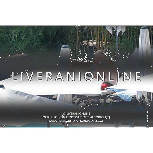 !!! EXCLUSIVE PHOTOS!!! !!! UWAGA ZDJECIA PAPARAZZI !!! BRAK ZGODY NA PUBLIKACJE WIZERUNKU !!! KADROWICZE PO PRZEGRANYM DRUGIM MECZU NA MUNDIALU RELAKSUJA SIE NA BASENIE. ZADOWOLENI USMIECHNIECI ZRELAKSOWANI WYCHODZA NA TRENING. WIEKSZOSC ZAWODNIKOW WYCHODZI Z TELEFONAMI NA TRENING. PRAWIE WSZYSCY SMIEJA SIE I SZUKAJA MIEJSCA SKAD SA ROBIONE IM ZDJECIA. JEDYNA PRZEJETA OSOBA JEST MICHAL PAZDAN KTORY CALY CZAS TRENINGU RZETELNIE PRACOWAL W SKUPIENIU I ZOSTAL JAKO OSTATNI Z DRUZYNY. N/Z JACEK GORLASKI I LUKASZ TEODORCZYK MUNDIAL 2018 25.06.2018 SOCHI TOBIASZ/NEWSPIX --- Newspix.pl Polish national team training in Sochi, part of the players training on the pitch, those who played with Colombia are training in the hotel, by the pool POLAND OUT!!! AG ALDO LIVERANI SAS-ONLY ITALY