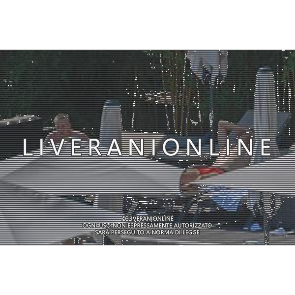 !!! EXCLUSIVE PHOTOS!!! !!! UWAGA ZDJECIA PAPARAZZI !!! BRAK ZGODY NA PUBLIKACJE WIZERUNKU !!! KADROWICZE PO PRZEGRANYM DRUGIM MECZU NA MUNDIALU RELAKSUJA SIE NA BASENIE. ZADOWOLENI USMIECHNIECI ZRELAKSOWANI WYCHODZA NA TRENING. WIEKSZOSC ZAWODNIKOW WYCHODZI Z TELEFONAMI NA TRENING. PRAWIE WSZYSCY SMIEJA SIE I SZUKAJA MIEJSCA SKAD SA ROBIONE IM ZDJECIA. JEDYNA PRZEJETA OSOBA JEST MICHAL PAZDAN KTORY CALY CZAS TRENINGU RZETELNIE PRACOWAL W SKUPIENIU I ZOSTAL JAKO OSTATNI Z DRUZYNY. N/Z JACEK GORLASKI I LUKASZ TEODORCZYK MUNDIAL 2018 25.06.2018 SOCHI TOBIASZ/NEWSPIX --- Newspix.pl Polish national team training in Sochi, part of the players training on the pitch, those who played with Colombia are training in the hotel, by the pool POLAND OUT!!! AG ALDO LIVERANI SAS-ONLY ITALY