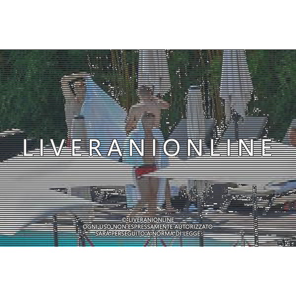 !!! EXCLUSIVE PHOTOS!!! !!! UWAGA ZDJECIA PAPARAZZI !!! BRAK ZGODY NA PUBLIKACJE WIZERUNKU !!! KADROWICZE PO PRZEGRANYM DRUGIM MECZU NA MUNDIALU RELAKSUJA SIE NA BASENIE. ZADOWOLENI USMIECHNIECI ZRELAKSOWANI WYCHODZA NA TRENING. WIEKSZOSC ZAWODNIKOW WYCHODZI Z TELEFONAMI NA TRENING. PRAWIE WSZYSCY SMIEJA SIE I SZUKAJA MIEJSCA SKAD SA ROBIONE IM ZDJECIA. JEDYNA PRZEJETA OSOBA JEST MICHAL PAZDAN KTORY CALY CZAS TRENINGU RZETELNIE PRACOWAL W SKUPIENIU I ZOSTAL JAKO OSTATNI Z DRUZYNY. N/Z JACEK GORLASKI I LUKASZ TEODORCZYK MUNDIAL 2018 25.06.2018 SOCHI TOBIASZ/NEWSPIX --- Newspix.pl Polish national team training in Sochi, part of the players training on the pitch, those who played with Colombia are training in the hotel, by the pool POLAND OUT!!! AG ALDO LIVERANI SAS-ONLY ITALY