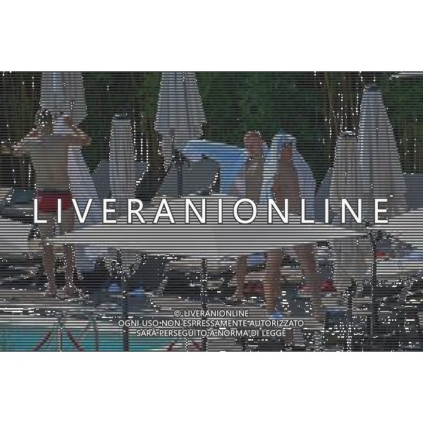 !!! EXCLUSIVE PHOTOS!!! !!! UWAGA ZDJECIA PAPARAZZI !!! BRAK ZGODY NA PUBLIKACJE WIZERUNKU !!! KADROWICZE PO PRZEGRANYM DRUGIM MECZU NA MUNDIALU RELAKSUJA SIE NA BASENIE. ZADOWOLENI USMIECHNIECI ZRELAKSOWANI WYCHODZA NA TRENING. WIEKSZOSC ZAWODNIKOW WYCHODZI Z TELEFONAMI NA TRENING. PRAWIE WSZYSCY SMIEJA SIE I SZUKAJA MIEJSCA SKAD SA ROBIONE IM ZDJECIA. JEDYNA PRZEJETA OSOBA JEST MICHAL PAZDAN KTORY CALY CZAS TRENINGU RZETELNIE PRACOWAL W SKUPIENIU I ZOSTAL JAKO OSTATNI Z DRUZYNY. N/Z JACEK GORLASKI I LUKASZ TEODORCZYK MUNDIAL 2018 25.06.2018 SOCHI TOBIASZ/NEWSPIX --- Newspix.pl Polish national team training in Sochi, part of the players training on the pitch, those who played with Colombia are training in the hotel, by the pool POLAND OUT!!! AG ALDO LIVERANI SAS-ONLY ITALY