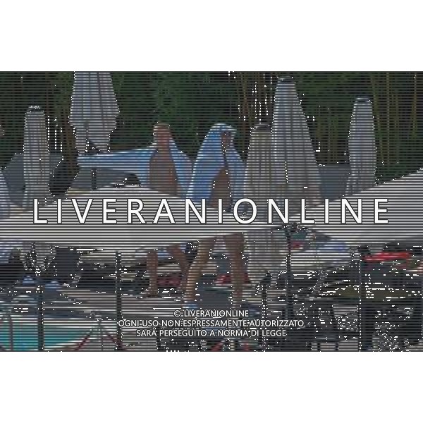 !!! EXCLUSIVE PHOTOS!!! !!! UWAGA ZDJECIA PAPARAZZI !!! BRAK ZGODY NA PUBLIKACJE WIZERUNKU !!! KADROWICZE PO PRZEGRANYM DRUGIM MECZU NA MUNDIALU RELAKSUJA SIE NA BASENIE. ZADOWOLENI USMIECHNIECI ZRELAKSOWANI WYCHODZA NA TRENING. WIEKSZOSC ZAWODNIKOW WYCHODZI Z TELEFONAMI NA TRENING. PRAWIE WSZYSCY SMIEJA SIE I SZUKAJA MIEJSCA SKAD SA ROBIONE IM ZDJECIA. JEDYNA PRZEJETA OSOBA JEST MICHAL PAZDAN KTORY CALY CZAS TRENINGU RZETELNIE PRACOWAL W SKUPIENIU I ZOSTAL JAKO OSTATNI Z DRUZYNY. N/Z JACEK GORLASKI I LUKASZ TEODORCZYK MUNDIAL 2018 25.06.2018 SOCHI TOBIASZ/NEWSPIX --- Newspix.pl Polish national team training in Sochi, part of the players training on the pitch, those who played with Colombia are training in the hotel, by the pool POLAND OUT!!! AG ALDO LIVERANI SAS-ONLY ITALY