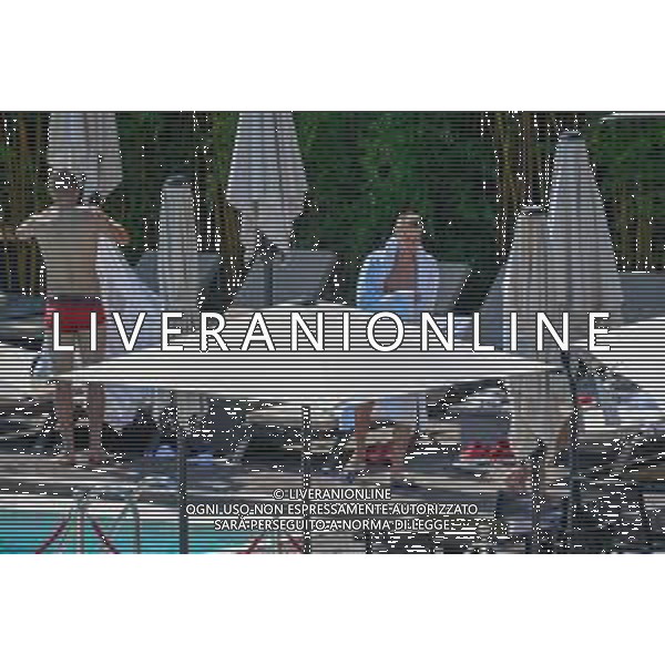 !!! EXCLUSIVE PHOTOS!!! !!! UWAGA ZDJECIA PAPARAZZI !!! BRAK ZGODY NA PUBLIKACJE WIZERUNKU !!! KADROWICZE PO PRZEGRANYM DRUGIM MECZU NA MUNDIALU RELAKSUJA SIE NA BASENIE. ZADOWOLENI USMIECHNIECI ZRELAKSOWANI WYCHODZA NA TRENING. WIEKSZOSC ZAWODNIKOW WYCHODZI Z TELEFONAMI NA TRENING. PRAWIE WSZYSCY SMIEJA SIE I SZUKAJA MIEJSCA SKAD SA ROBIONE IM ZDJECIA. JEDYNA PRZEJETA OSOBA JEST MICHAL PAZDAN KTORY CALY CZAS TRENINGU RZETELNIE PRACOWAL W SKUPIENIU I ZOSTAL JAKO OSTATNI Z DRUZYNY. N/Z JACEK GORLASKI I LUKASZ TEODORCZYK MUNDIAL 2018 25.06.2018 SOCHI TOBIASZ/NEWSPIX --- Newspix.pl Polish national team training in Sochi, part of the players training on the pitch, those who played with Colombia are training in the hotel, by the pool POLAND OUT!!! AG ALDO LIVERANI SAS-ONLY ITALY