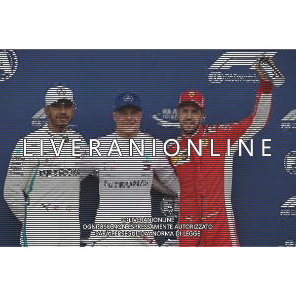 Qualifying top three in parc ferme (L to R): Lewis Hamilton (GBR) Mercedes AMG F1, second; Valtteri Bottas (FIN) Mercedes AMG F1, pole position; Sebastian Vettel (GER) Ferrari, third. 30.06.2018. Formula 1 World Championship, Rd 9, Austrian Grand Prix, Spielberg, Austria, Qualifying Day. / AGENZIA ALDO LIVERANI SAS - ITALY ONLY EDITORIAL USE ONLY - F1 Gp Austria, Prove Ufficiali Qualifiche 30.06.2018