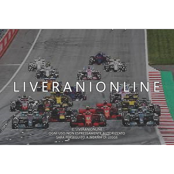 (L to R): Lewis Hamilton (GBR) Mercedes AMG F1 W09; Kimi Raikkonen (FIN) Ferrari SF71H; and Valtteri Bottas (FIN) Mercedes AMG F1 W09, at the start of the race. 01.07.2018. Formula 1 World Championship, Rd 9, Austrian Grand Prix, Spielberg, Austria, Race Day. / AGENZIA ALDO LIVERANI SAS - ITALY ONLY EDITORIAL USE ONLY - F1 GP AUSTRIA GARA 01.07.2018