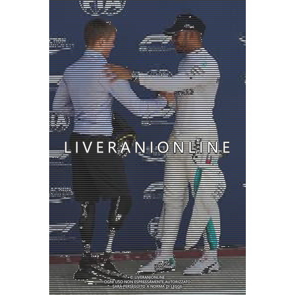 (L to R): Billy Monger (GBR) Racing Driver presents the Pirelli Pole Position award to Lewis Hamilton (GBR) Mercedes AMG F1. 07.07.2018. Formula 1 World Championship, Rd 10, British Grand Prix, Silverstone, England, Qualifying Day. / AGENZIA ALDO LIVERANI SAS - ITALY ONLY EDITORIAL USE ONLY - F1 GP INGHILTERRA GRAN BRETAGNA PROVE UFFICIALI QUALIFICHE 07.07.2018