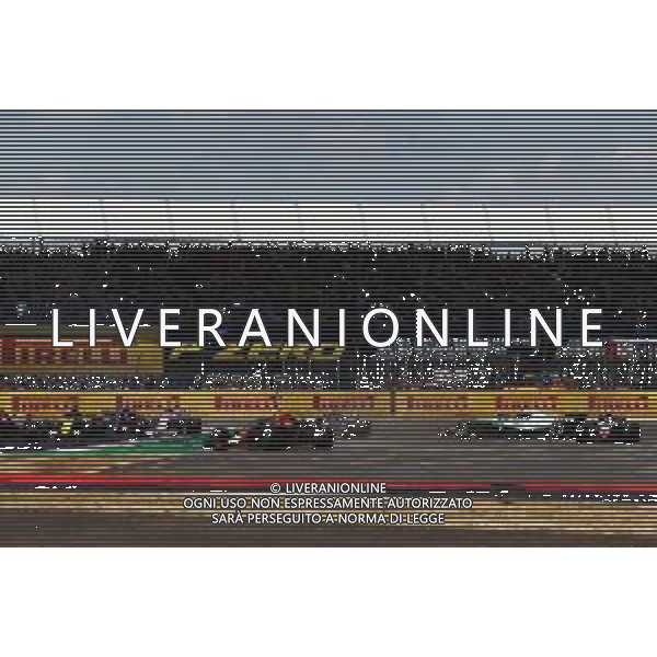 Lewis Hamilton (GBR) Mercedes AMG F1 W09 collided with Kimi Raikkonen (FIN) Ferrari SF71H at the start of the race. 08.07.2018. Formula 1 World Championship, Rd 10, British Grand Prix, Silverstone, England, Race Day. / AGENZIA ALDO LIVERANI SAS - ITALY ONLY EDITORIAL USE ONLY - F1 Gp Inghilterra Gran Bretagna Gara 08-07-2018
