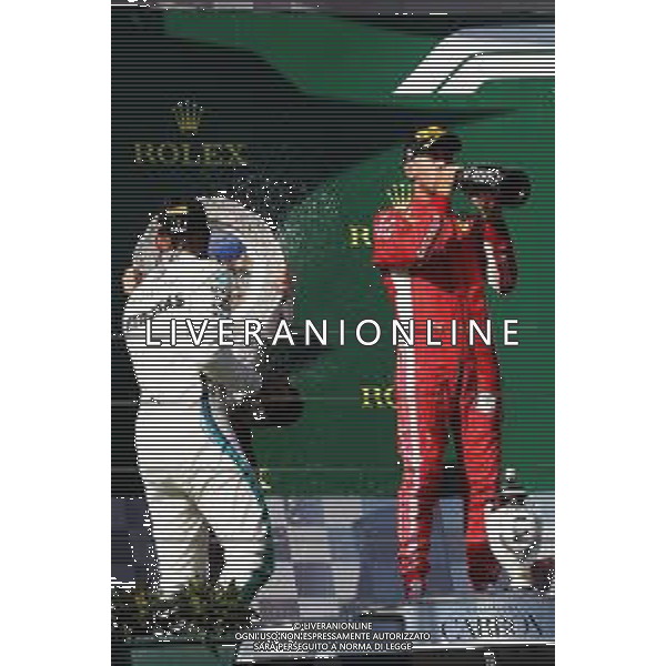 (L to R): Race winner Lewis Hamilton (GBR) Mercedes AMG F1 celebrates with the champagne on the podium with second placed Sebastian Vettel (GER) Ferrari. 29.07.2018. Formula 1 World Championship, Rd 12, Hungarian Grand Prix, Budapest, Hungary, Race Day. /AGENZIA ALDO LIVERANI SAS - ITALY ONLY - EDITORIAL USE ONLY - F1 GP UNGHERIA GARA 29.07.2018