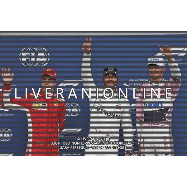 Qualifying top three in parc ferme (L to R): Sebastian Vettel (GER) Ferrari, second; Lewis Hamilton (GBR) Mercedes AMG F1, pole position; Esteban Ocon (FRA) Racing Point Force India F1 Team, third. 25.08.2018. Formula 1 World Championship, Rd 13, Belgian Grand Prix, Spa Francorchamps, Belgium, Qualifying Day. AG ALDO LIVERANI SAS-ONLY ITALY