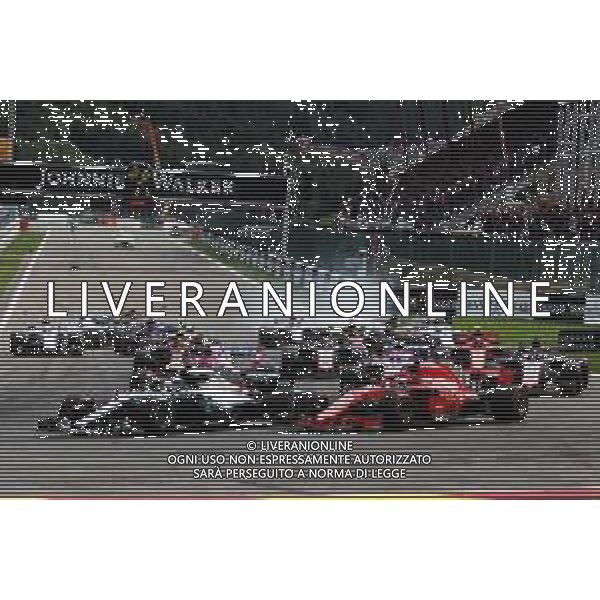 Lewis Hamilton (GBR) Mercedes AMG F1 W09 and Sebastian Vettel (GER) Ferrari SF71H lead at the start of the race. 26.08.2018. Formula 1 World Championship, Rd 13, Belgian Grand Prix, Spa Francorchamps, Belgium, Race Day. / AGENZIA ALDO LIVERANI SAS - ITALY ONLY EDITORIAL USE ONLY - Gp Belgio, Spa Francorchamps, Gara 26.08.2018.