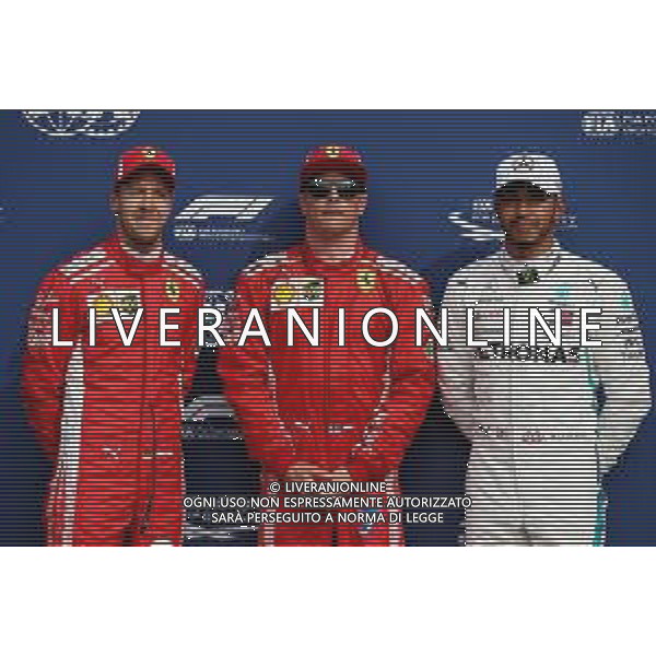 Qualifying top three in parc ferme (L to R): Sebastian Vettel (GER) Ferrari, second; Kimi Raikkonen (FIN) Ferrari, pole position; Lewis Hamilton (GBR) Mercedes AMG F1, third. 01.09.2018. Formula 1 World Championship, Rd 14, Italian Grand Prix, Monza, Italy, Qualifying Day. AG ALDO LIVERANI SAS-ONLY ITALY