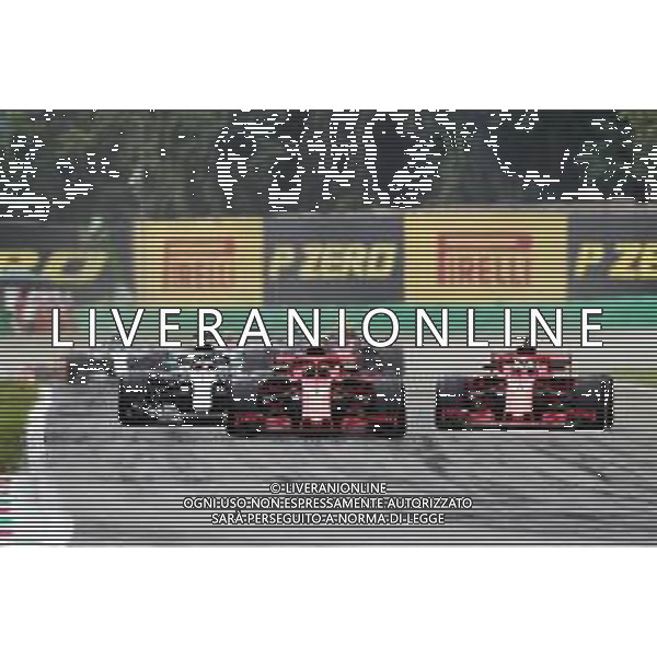 Kimi Raikkonen (FIN) Ferrari SF71H leads Lewis Hamilton (GBR) Mercedes AMG F1 W09 and Sebastian Vettel (GER) Ferrari SF71H at the start of the race. 02.09.2018. Formula 1 World Championship, Rd 14, Italian Grand Prix, Monza, Italy, Race Day. AG ALDO LIVERANI SAS-ONLY ITALY