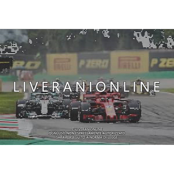 Kimi Raikkonen (FIN) Ferrari SF71H leads Lewis Hamilton (GBR) Mercedes AMG F1 W09 and Sebastian Vettel (GER) Ferrari SF71H at the start of the race. 02.09.2018. Formula 1 World Championship, Rd 14, Italian Grand Prix, Monza, Italy, Race Day. AG ALDO LIVERANI SAS-ONLY ITALY
