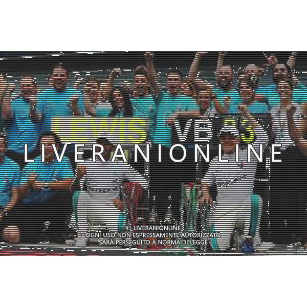 Race winner Lewis Hamilton (GBR) Mercedes AMG F1 celebrates with third placed Valtteri Bottas (FIN) Mercedes AMG F1 and the team. 02.09.2018. Formula 1 World Championship, Rd 14, Italian Grand Prix, Monza, Italy, Race Day. AG ALDO LIVERANI SAS-ONLY ITALY