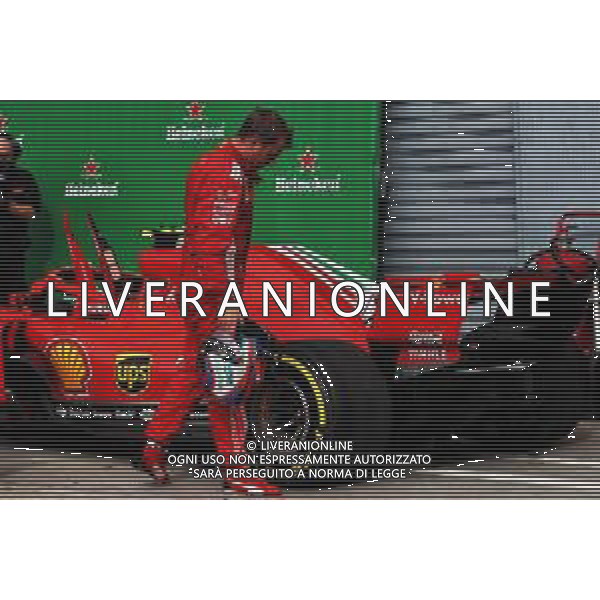 Kimi Raikkonen (FIN) looks at the rear tyre on his Ferrari SF71H in parc ferme. 02.09.2018. Formula 1 World Championship, Rd 14, Italian Grand Prix, Monza, Italy, Race Day. AG ALDO LIVERANI SAS-ONLY ITALY
