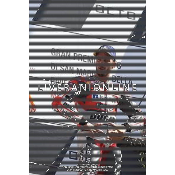 Misano Adriatico ( RN ) 09/09/2018 Misano World Circuit Marco Simoncelli. Gran Premio Octo di San Marino e della Riviera di Rimini 2018 - MOTOGP Premiazione Nella foto: Il vincitore Andrea Dovizioso ( ITA ) su DUCATI sul podio PH Lauro Montagnini AG ALDO LIVERANI SAS