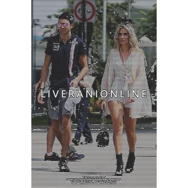 Esteban Ocon (FRA) Racing Point Force India F1 Team with Elena Berri. 14.09.2018. Formula 1 World Championship, Rd 15, Singapore Grand Prix, Marina Bay Street Circuit, Singapore, Practice Day. AG ALDO LIVERANI SAS-ONLY ITALY