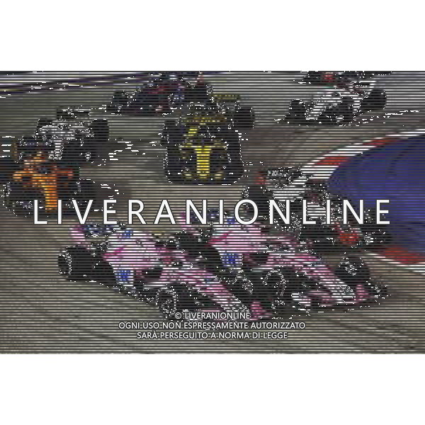 Esteban Ocon (FRA) Racing Point Force India F1 VJM11 and team mate Sergio Perez (MEX) Racing Point Force India F1 VJM11 at the start of the race. 16.09.2018. Formula 1 World Championship, Rd 15, Singapore Grand Prix, Marina Bay Street Circuit, Singapore, Race Day. / AGENZIA ALDO LIVERANI SAS - ITALY ONLY EDITORIAL USE ONLY