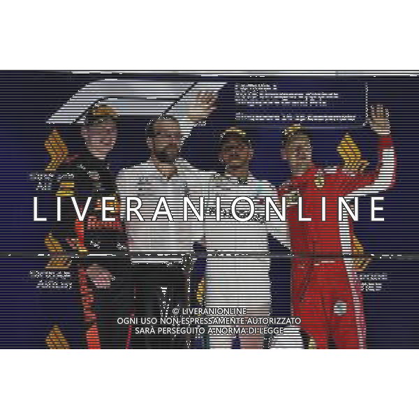 The podium (L to R): Max Verstappen (NLD) Red Bull Racing, second; Lewis Hamilton (GBR) Mercedes AMG F1, race winner; Sebastian Vettel (GER) Ferrari, third. 16.09.2018. Formula 1 World Championship, Rd 15, Singapore Grand Prix, Marina Bay Street Circuit, Singapore, Race Day. AG ALDO LIVERANI SAS-ONLY ITALY