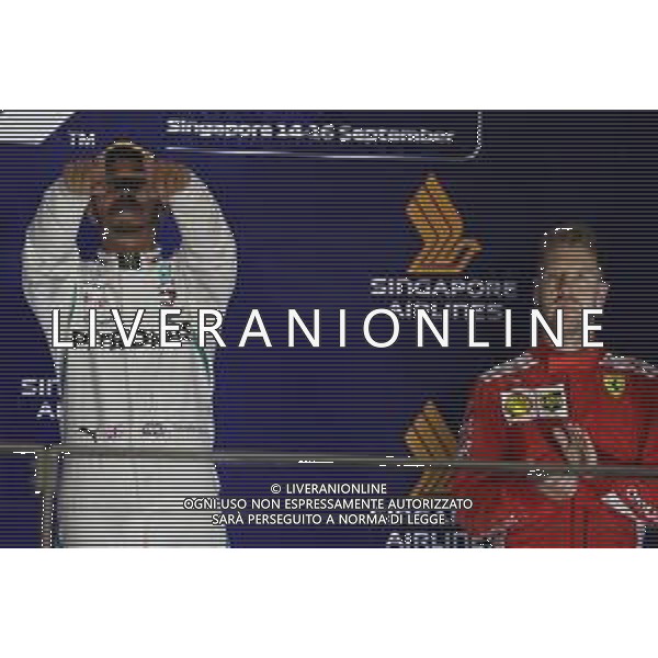1st place Lewis Hamilton (GBR) Mercedes AMG F1 W09 and 3rd place Sebastian Vettel (GER) Ferrari SF71H. 16.09.2018. Formula 1 World Championship, Rd 15, Singapore Grand Prix, Marina Bay Street Circuit, Singapore, Race Day. AG ALDO LIVERANI SAS-ONLY ITALY