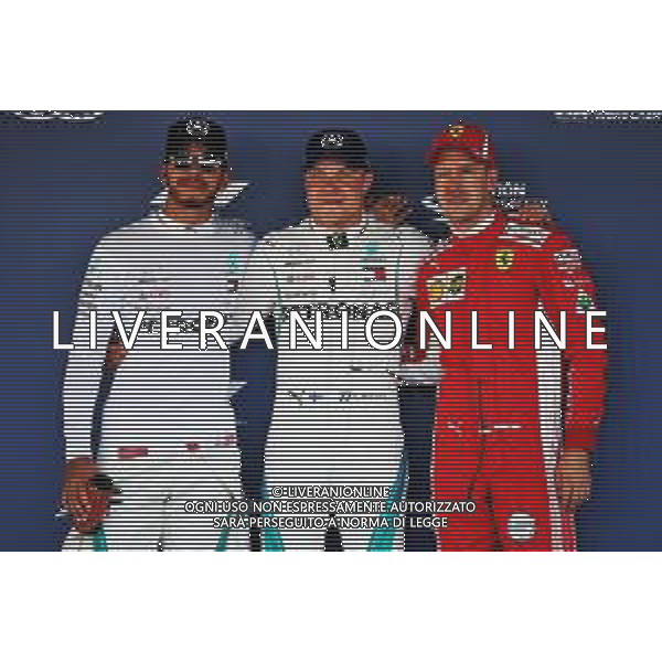 Qualifying top three in parc ferme (L to R): Lewis Hamilton (GBR) Mercedes AMG F1, third; Valtteri Bottas (FIN) Mercedes AMG F1, pole position; Sebastian Vettel (GER) Ferrari, second. 29.09.2018. Formula 1 World Championship, Rd 16, Russian Grand Prix, Sochi Autodrom, Sochi, Russia, Qualifying Day. AG ALDO LIVERANI SAS-ONLY ITALY