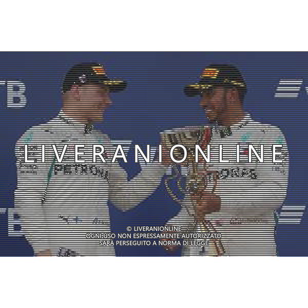 2nd place Valtteri Bottas (FIN) Mercedes AMG F1 with 1st place Lewis Hamilton (GBR) Mercedes AMG F1 W09. 30.09.2018. Formula 1 World Championship, Rd 16, Russian Grand Prix, Sochi Autodrom, Sochi, Russia, Race Day. / AGENZIA ALDO LIVERANI SAS - ITALY ONLY EDITORIAL USE ONLY