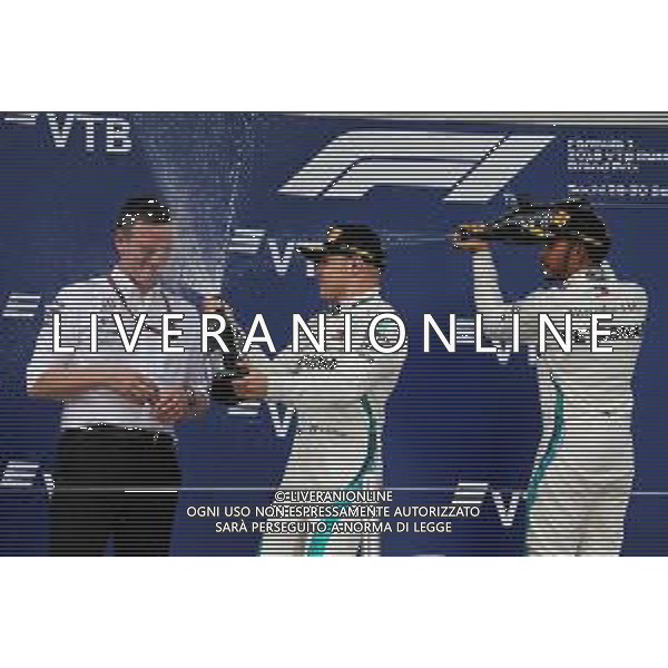 (L to R): James Allison (GBR) Mercedes AMG F1 Technical Director on the podium with second placed Valtteri Bottas (FIN) Mercedes AMG F1 and race winner Lewis Hamilton (GBR) Mercedes AMG F1. 30.09.2018. Formula 1 World Championship, Rd 16, Russian Grand Prix, Sochi Autodrom, Sochi, Russia, Race Day. / AGENZIA ALDO LIVERANI SAS - ITALY ONLY EDITORIAL USE ONLY