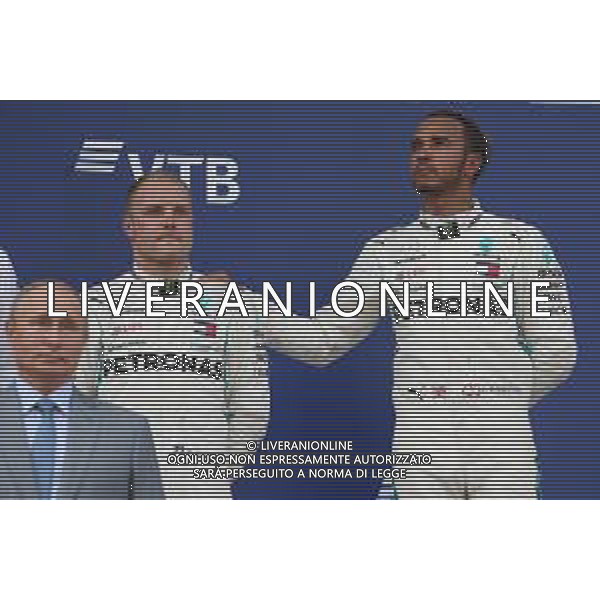Vladimir Putin (RUS) Russian Federation President with Valtteri Bottas (FIN) Mercedes AMG F1 and Lewis Hamilton (GBR) Mercedes AMG F1 W09. 30.09.2018. Formula 1 World Championship, Rd 16, Russian Grand Prix, Sochi Autodrom, Sochi, Russia, Race Day. / AGENZIA ALDO LIVERANI SAS - ITALY ONLY EDITORIAL USE ONLY
