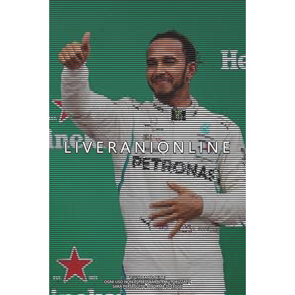 Race winner Lewis Hamilton (GBR) Mercedes AMG F1 celebrates on the podium. 11.11.2018. Formula 1 World Championship, Rd 20, Brazilian Grand Prix, Sao Paulo, Brazil, Race Day. AG ALDO LIVERANI SAS-ONLY ITALY