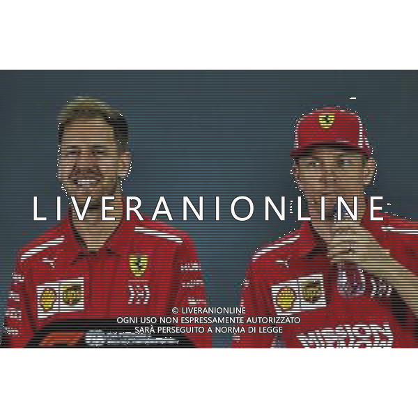 (L to R): Sebastian Vettel (GER) Ferrari and Kimi Raikkonen (FIN) Ferrari in the FIA Press Conference. 22.11.2018. Formula 1 World Championship, Rd 21, Abu Dhabi Grand Prix, Yas Marina Circuit, Abu Dhabi, Preparation Day. AG ALDO LIVERANI SAS-ONLY ITALY