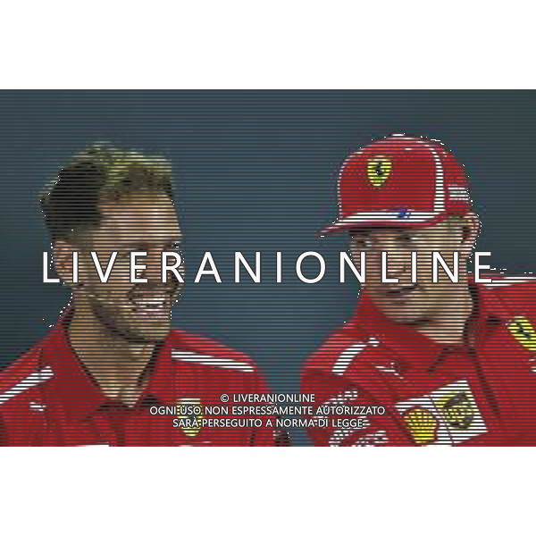 (L to R): Sebastian Vettel (GER) Ferrari and Kimi Raikkonen (FIN) Ferrari in the FIA Press Conference. 22.11.2018. Formula 1 World Championship, Rd 21, Abu Dhabi Grand Prix, Yas Marina Circuit, Abu Dhabi, Preparation Day. AG ALDO LIVERANI SAS-ONLY ITALY