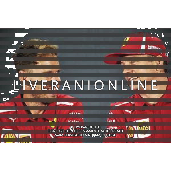 (L to R): Sebastian Vettel (GER) Ferrari with Kimi Raikkonen (FIN) Ferrari in the FIA Press Conference. 22.11.2018. Formula 1 World Championship, Rd 21, Abu Dhabi Grand Prix, Yas Marina Circuit, Abu Dhabi, Preparation Day. AG ALDO LIVERANI SAS-ONLY ITALY