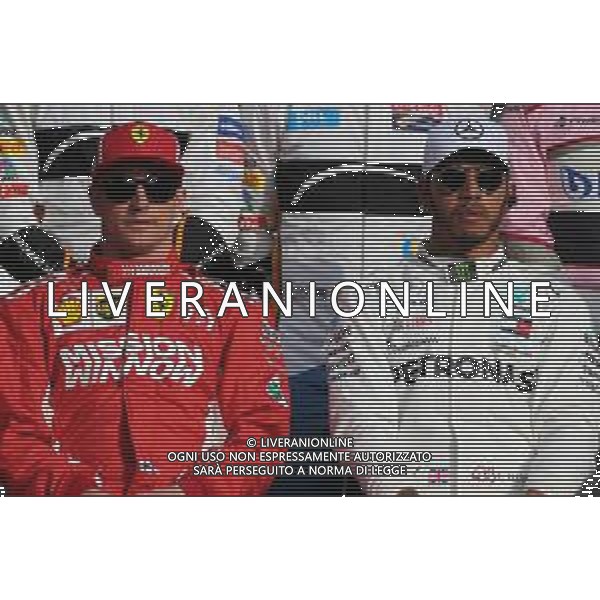 Kimi Raikkonen (FIN) Scuderia Ferrari and Lewis Hamilton (GBR) Mercedes AMG F1 25.11.2018. Formula 1 World Championship, Rd 21, Abu Dhabi Grand Prix, Yas Marina Circuit, Abu Dhabi, Race Day. AG ALDO LIVERANI SAS-ONLY ITALY