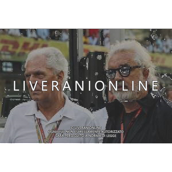 (L to R): Marco Tronchetti Provera (ITA) Pirelli Chairman with Flavio Briatore (ITA) on the grid. 25.11.2018. Formula 1 World Championship, Rd 21, Abu Dhabi Grand Prix, Yas Marina Circuit, Abu Dhabi, Race Day. AG ALDO LIVERANI SAS-ONLY ITALY