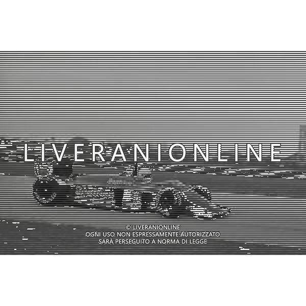 RETROSPETTIVA ALAN JONES PILOTA F1 NELLA FOTO ALAN JONES GP MONZA F1 1986-87 AG ALDO LIVERANI SAS