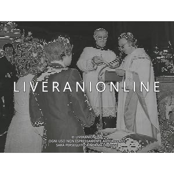 RETROSPETTIVA PADRE ELIGIO Padre Eligio, pseudonimo di Angelo Gelmini, affettuosamente Peligio (Pozzuolo Martesana, 17 luglio 1931), è un presbitero italiano. NELLA FOTO PADRE ELIGIO AG ALDO LIVERANI SAS