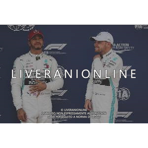 (L to R): Lewis Hamilton (GBR) Mercedes AMG F1 with pole sitter and team mate Valtteri Bottas (FIN) Mercedes AMG F1 in qualifying parc ferme. 13.04.2019. Formula 1 World Championship, Rd 3, Chinese Grand Prix, Shanghai, China, Qualifying Day.