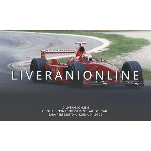 RETROSPETTIVA EDDIE IRVINE PILOTA F1 NELLA FOTO EDDIE IRVINE NEL 1997 CON LA FERRARI F 310 B AG ALDO LIVERANI SAS 