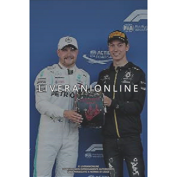 (L to R): Valtteri Bottas (FIN) Mercedes AMG F1 receives the Pirelli Pole Position award from Jack Aitken (GBR) / (KOR) Renault F1 Team Test Driver. 27.04.2019. Formula 1 World Championship, Rd 4, Azerbaijan Grand Prix, Baku Street Circuit, Azerbaijan, Qualifying Day. AG ALDO LIVERANI SAS-ONLY ITALY