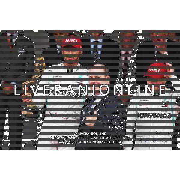 (L to R): race winner Lewis Hamilton (GBR) Mercedes AMG F1 celebrates on the podium with HSH Prince Albert of Monaco (MON) and third placed team mate Valtteri Bottas (FIN) Mercedes AMG F1. 26.05.2019. Formula 1 World Championship, Rd 6, Monaco Grand Prix, Monte Carlo, Monaco, Race Day. AG ALDO LIVERANI SAS-ONLY ITALY