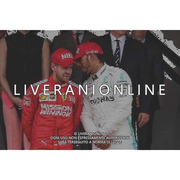 (L to R): second placed Sebastian Vettel (GER) Ferrari on the podium with race winner Lewis Hamilton (GBR) Mercedes AMG F1. 26.05.2019. Formula 1 World Championship, Rd 6, Monaco Grand Prix, Monte Carlo, Monaco, Race Day. / AGENZIA ALDO LIVERANI SAS - ITALY ONLY EDITORIAL USE ONLY